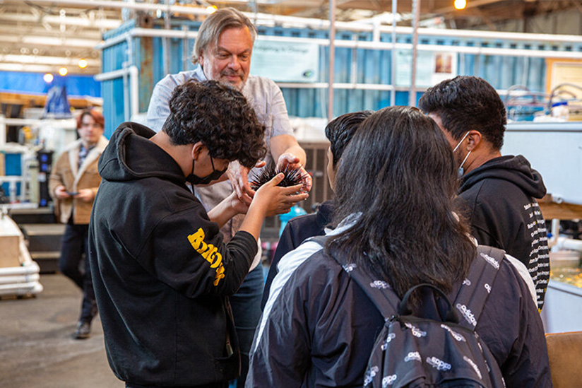 Professor Sergey Nuzhdin shares a sea urchin with students from King/Drew Magnet High School of Medicine and Science during their visit to Nuzhdin’s marine science lab. (Photos: Mike Glier.)