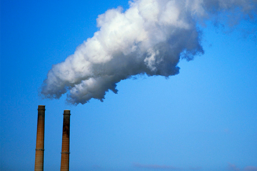 Smoke stacks emitting smoke