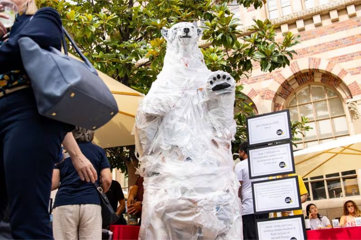 A polar bear made entirely of recycled trash is presented at the Grand Opening of the Sustainability Hub. (Photo by Drake Lee)