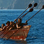 Members of the Ti’at Society paddle their traditional Tongva plank canoe, Moomat Ahiko (“Breath of the Ocean”), off the coast of Southern California’s Santa Catalina Island. (Photo: Frank Magallanes and Althea Edwards.)