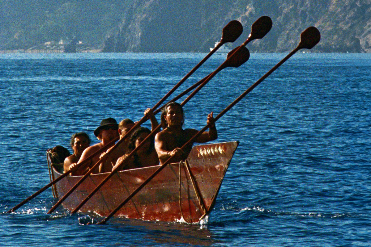 Members of the Ti’at Society paddle their traditional Tongva plank canoe, Moomat Ahiko (“Breath of the Ocean”), off the coast of Southern California’s Santa Catalina Island. (Photo: Frank Magallanes and Althea Edwards.)