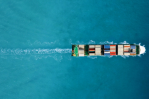 Aerial photo of a cargo ship on the ocean.