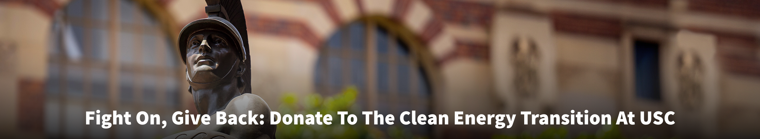 A picture of Tommy Trojan with the text "Fight On, Give Back: Donate To The Clean Energy Transition At USC"