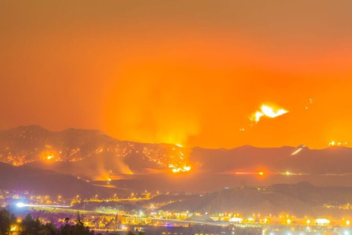 Photo shows Night long exposure photograph of the Santa Clarita wildfire (Photo/iStock FrozenShutter).