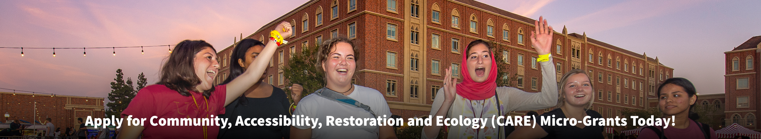 Students during the residential college welcome festival with the text "Apply for Community, Accessibility, Restoration and Ecology (CARE) Micro-Grants Today!"