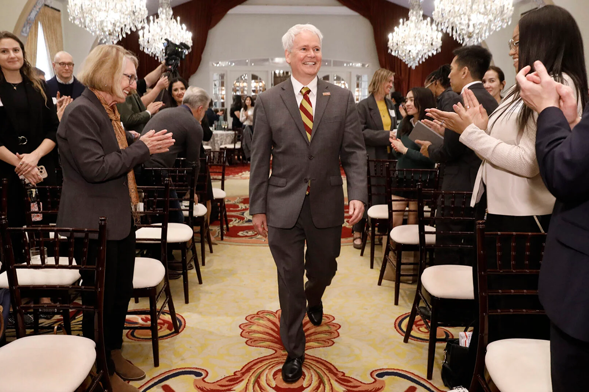 The crowd applauds for Chris Boone at his installation as USC Price dean. (USC Photo/Steve Cohn)